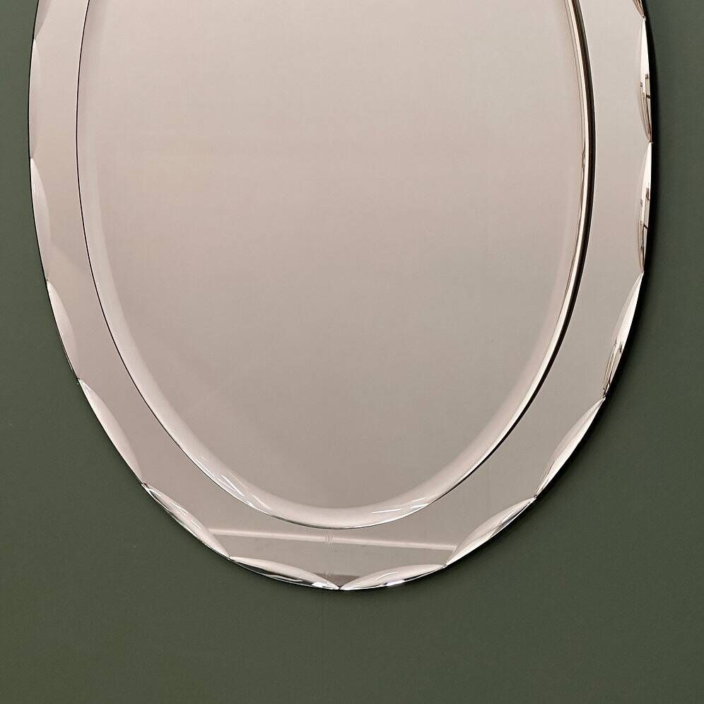1970s Italian oval mirror by Crystal Arte with faceted glass frame