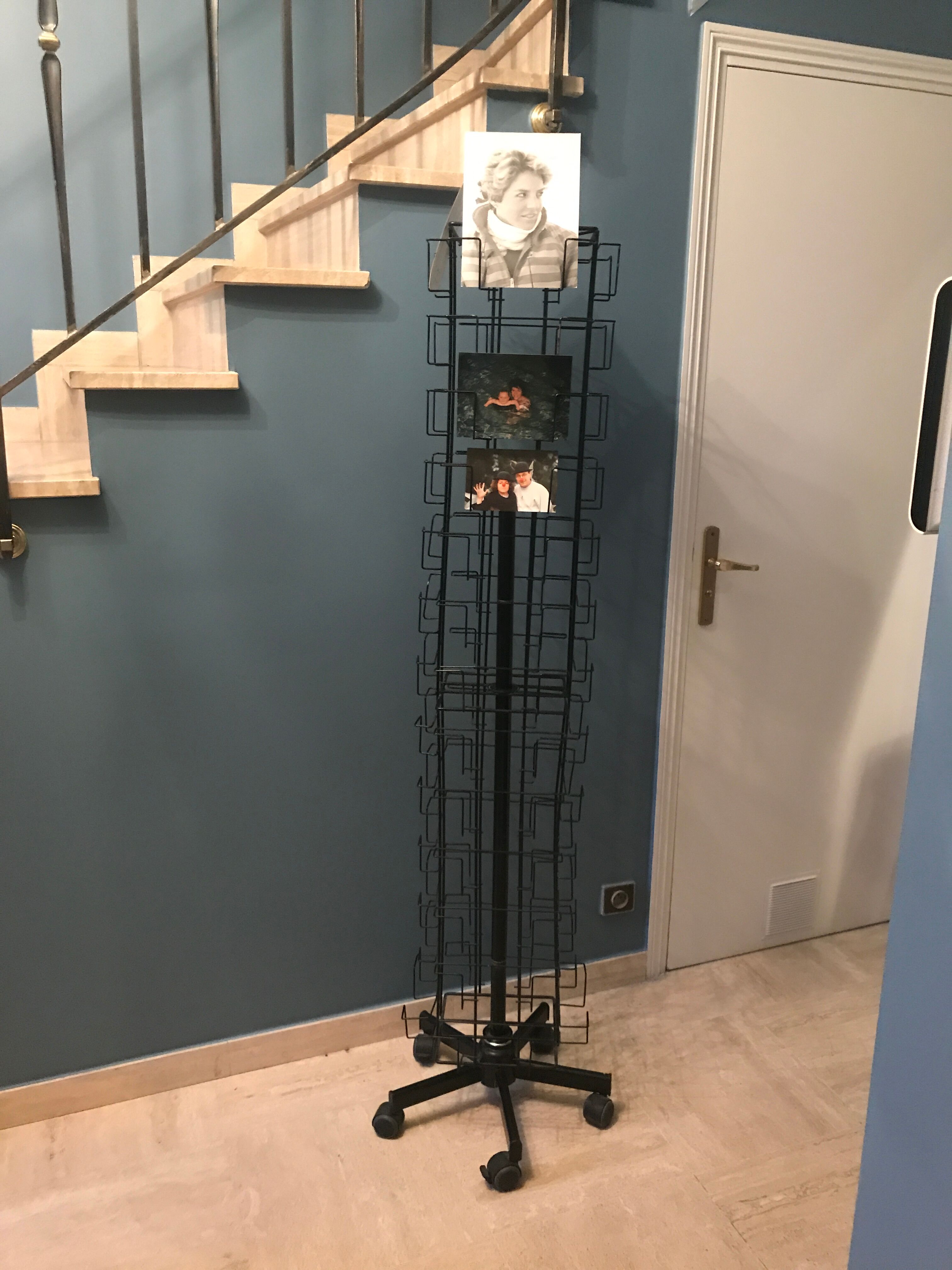 Display postcards and photos in black metal turnstile