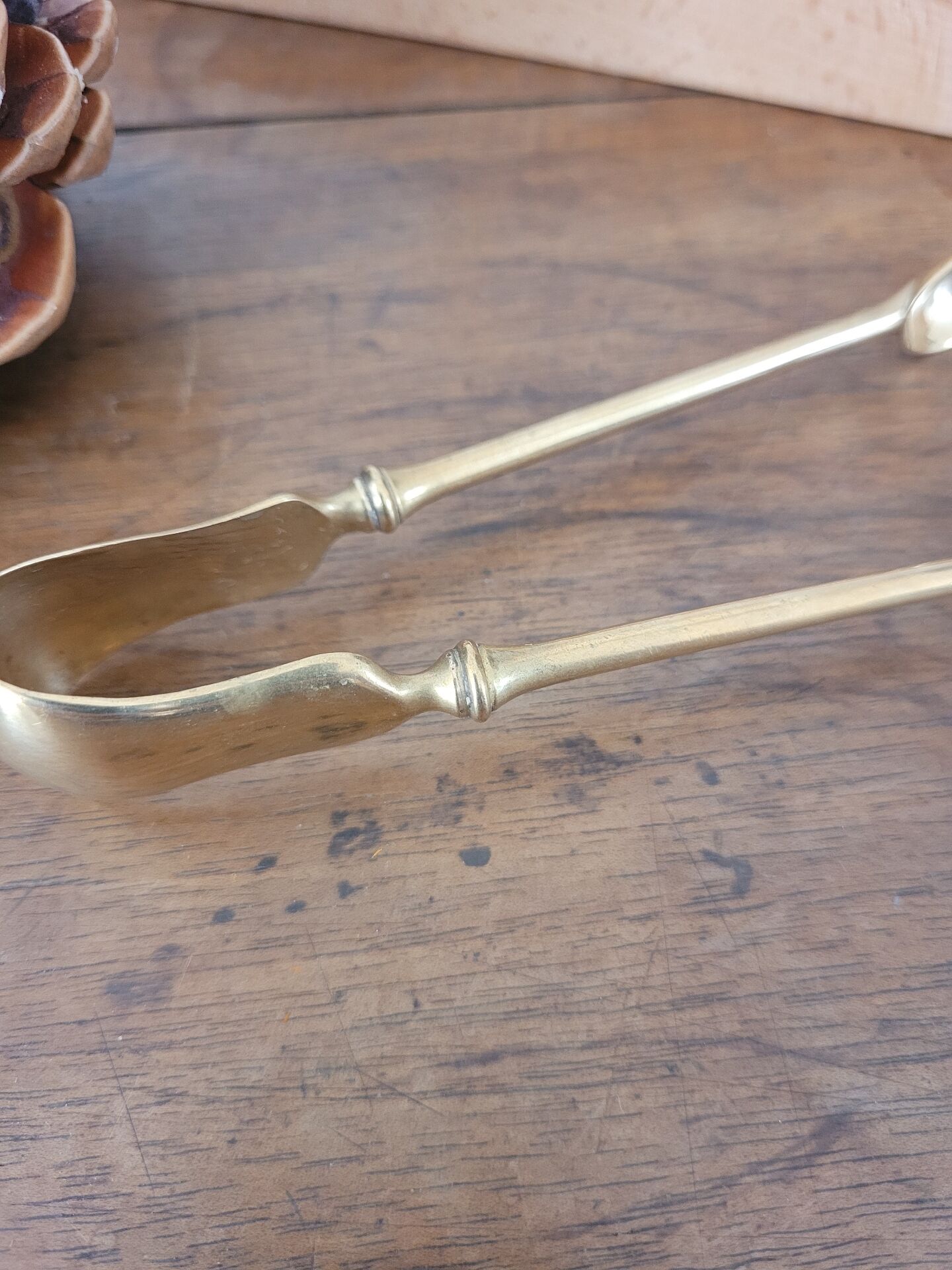Golden metal sugar tongs