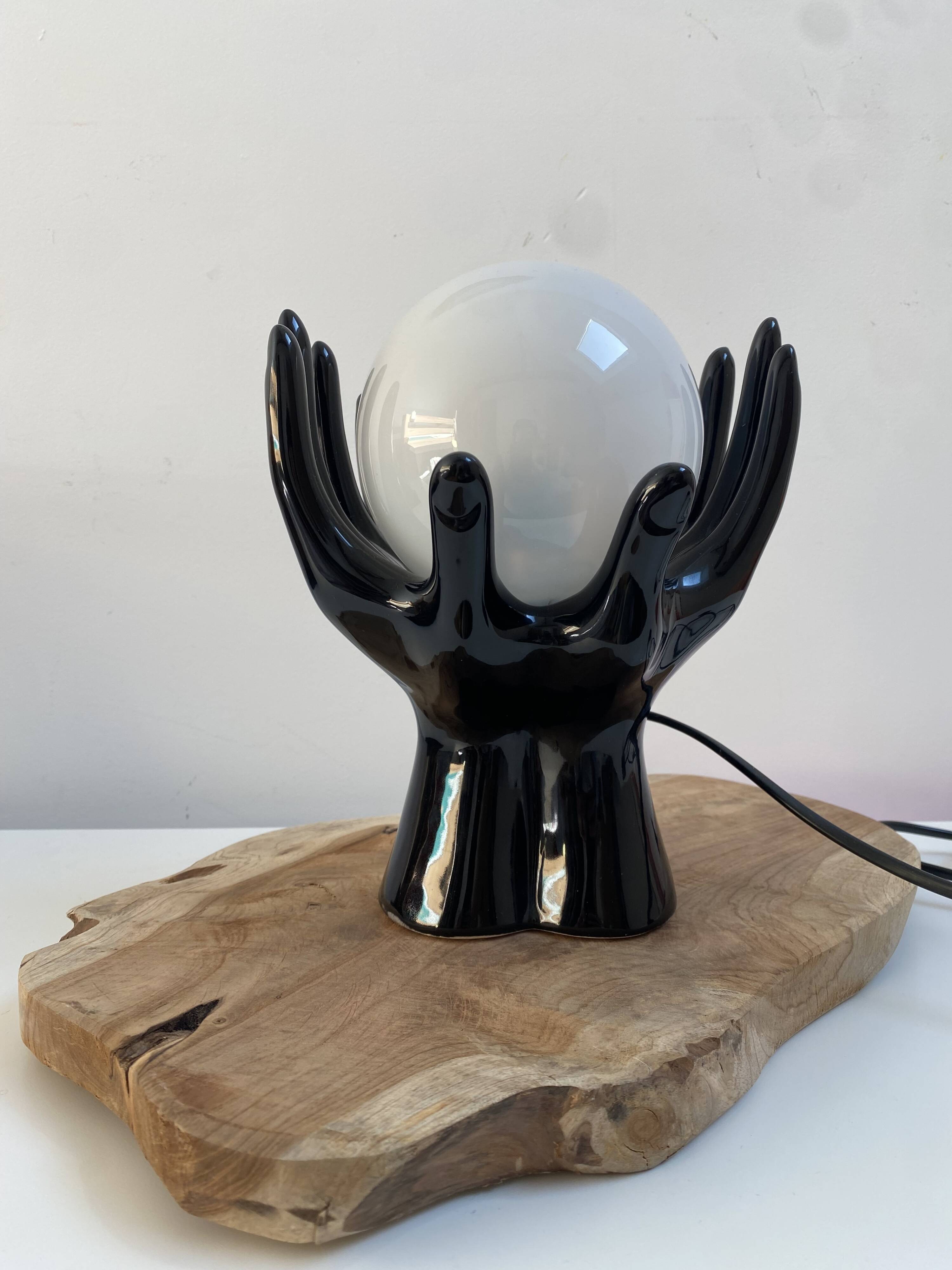 Sculpted ceramic globe lamp.
