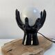 Sculpted ceramic globe lamp.