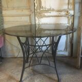 Table ronde pieds métal et verre fumée