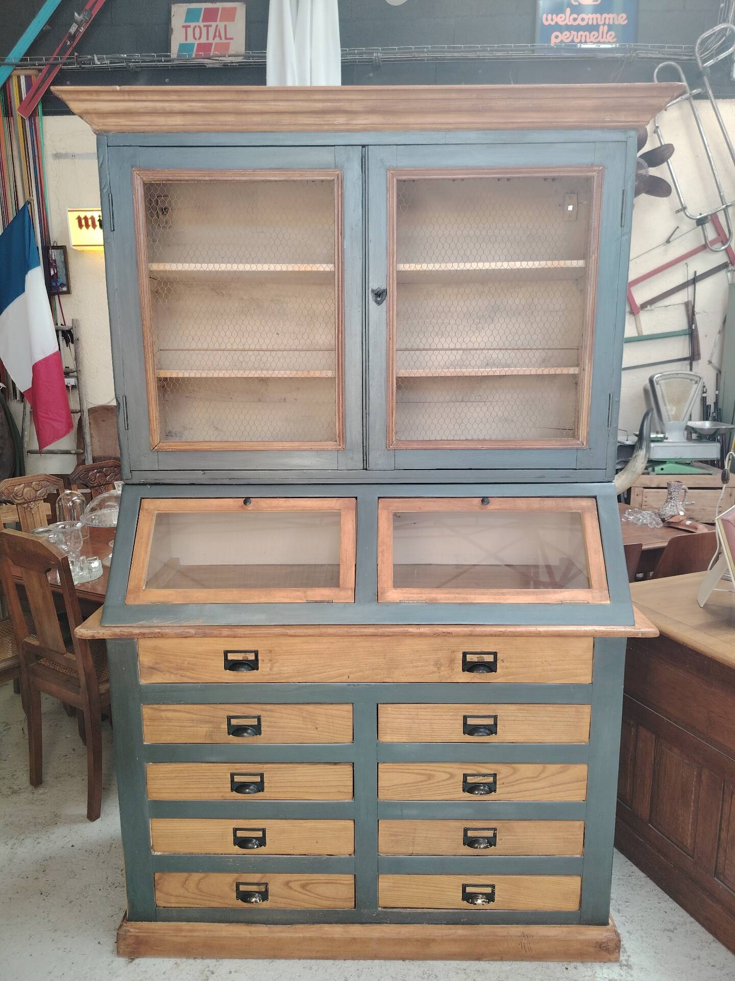 Large two-body grain merchant cabinet made of solid wood.