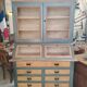 Large two-body grain merchant cabinet made of solid wood.