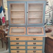 Large two-body grain merchant cabinet made of solid wood.