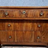 Empire period chest of drawers in walnut and gilded bronze circa 1810-1820