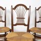 3 wooden and straw chairs, decorated with a sheaf of wheat.