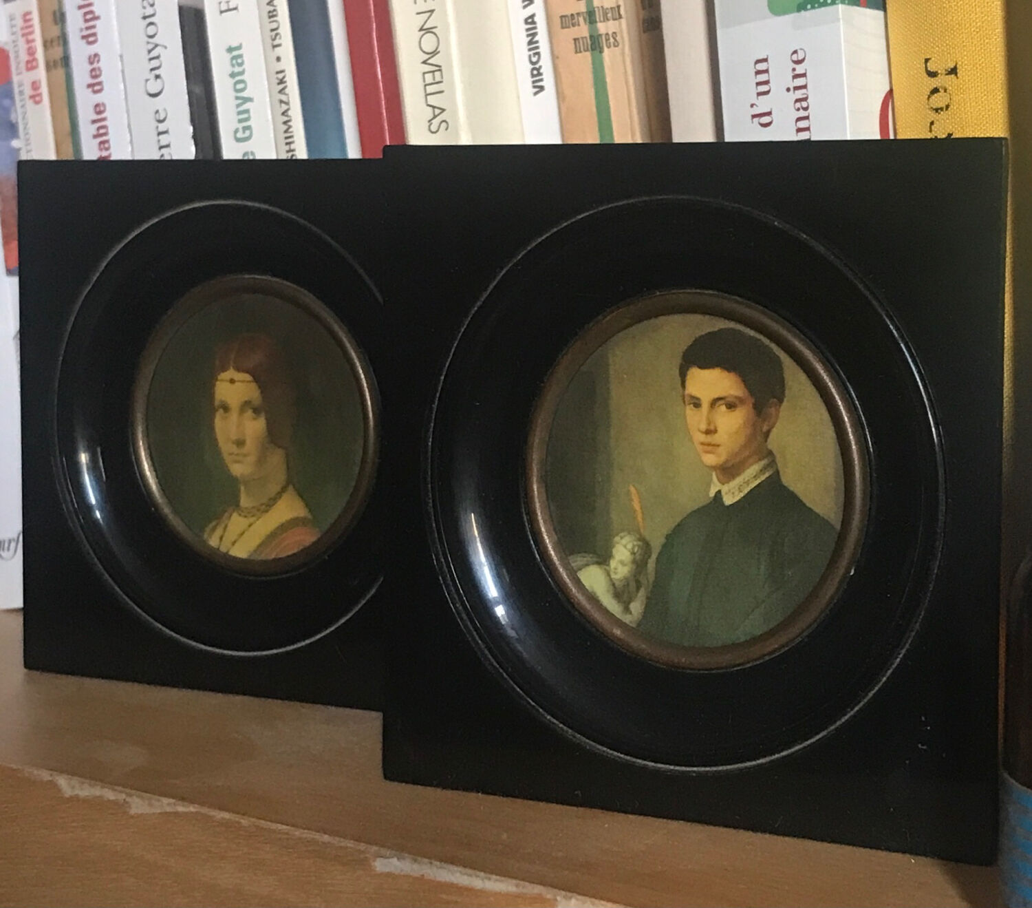 Two vintage round frame portraits