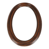Large old oval wooden mirror