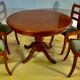Round or oval table with four chairs in solid cherry, with extensions