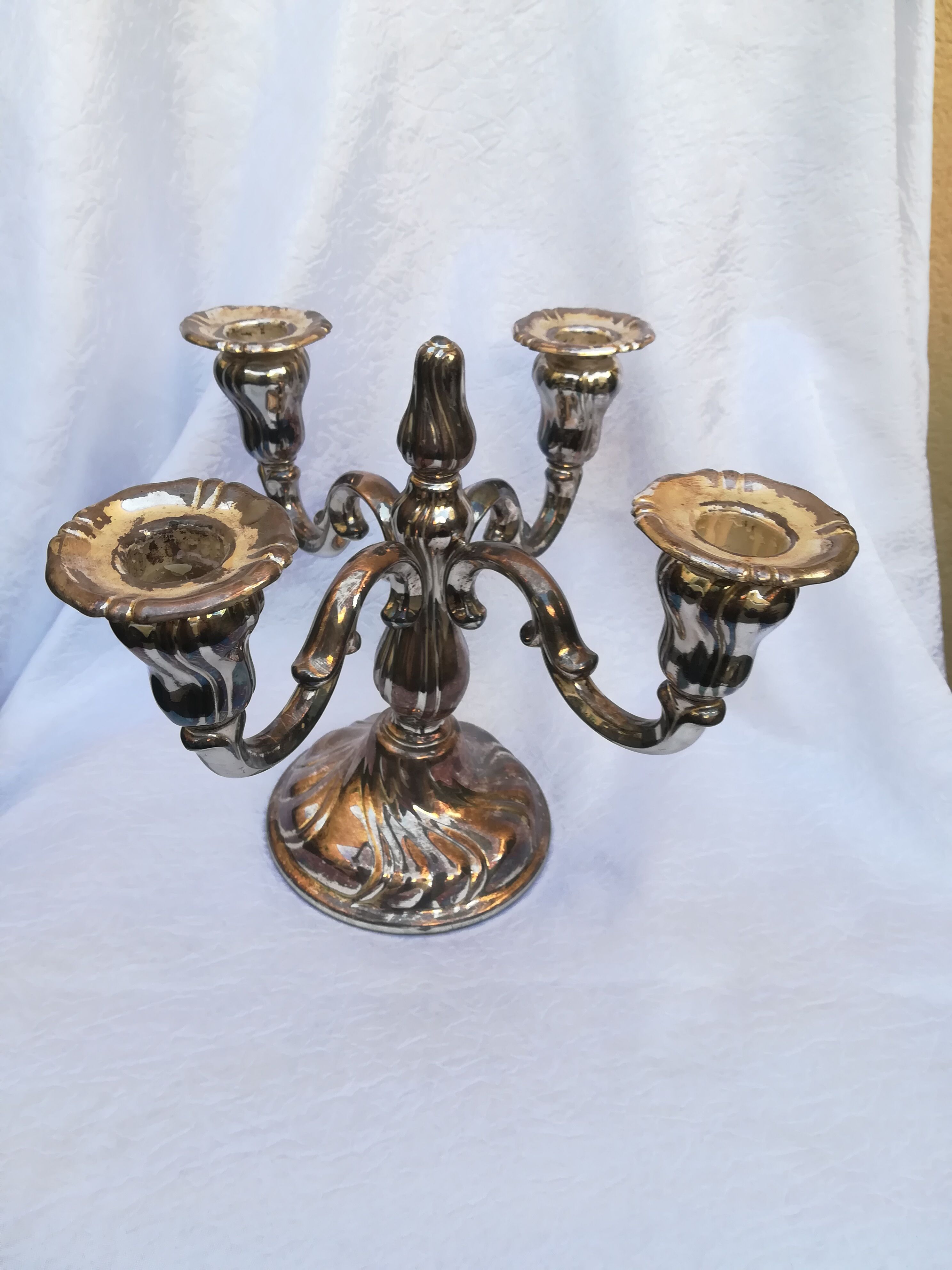 Pair of candlesticks in silver metal