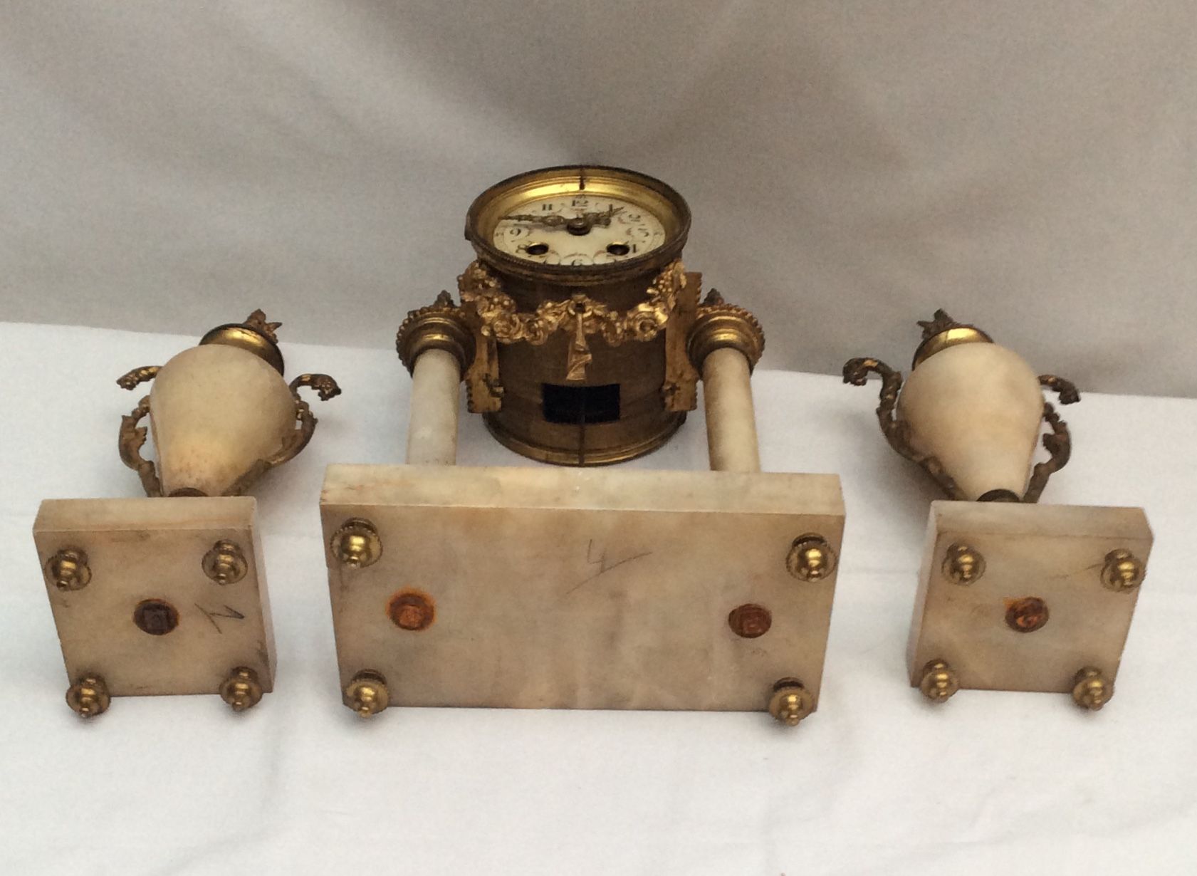 Clock fireplace trim and two vases in onyx and bronze style Louis XVI