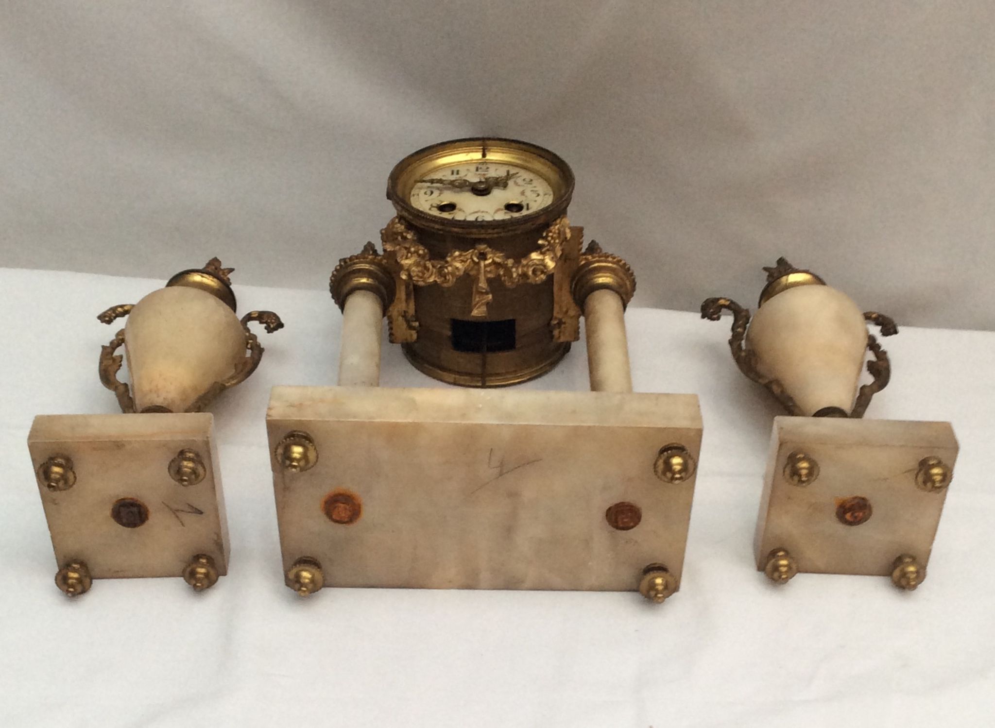Clock fireplace trim and two vases in onyx and bronze style Louis XVI