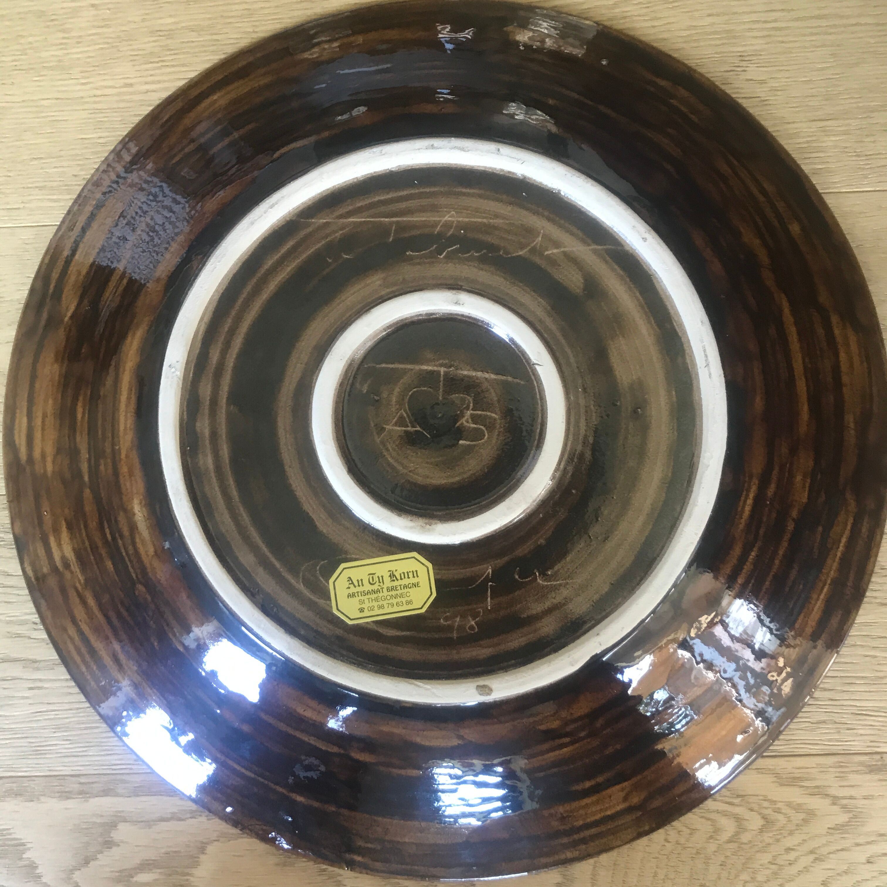 Large ceramic dish by Jean Claude Taburet in Quimper Brittany