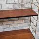 Shelf 1950 has 70 gold uprights and and plating shelf with black plastic border,