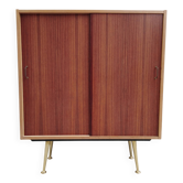 decorative midcentury cabinet with brass legs