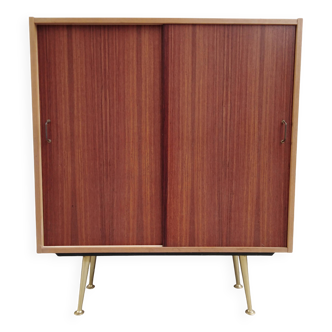 decorative midcentury cabinet with brass legs