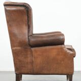 Vintage wingback armchair made of sheepskin leather with beautiful colours