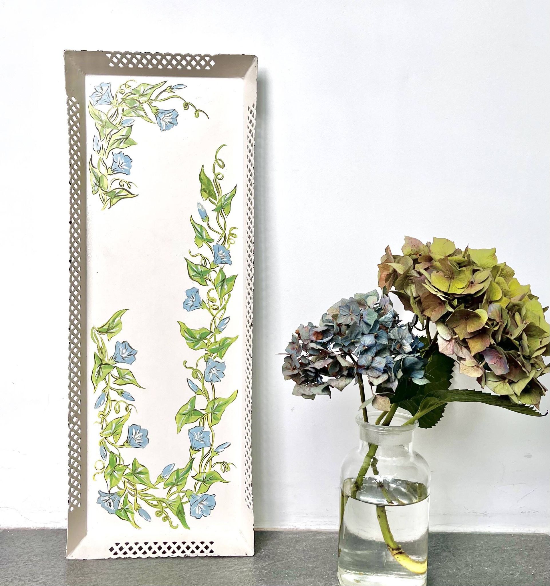 Large painted sheet metal tray with flower decoration