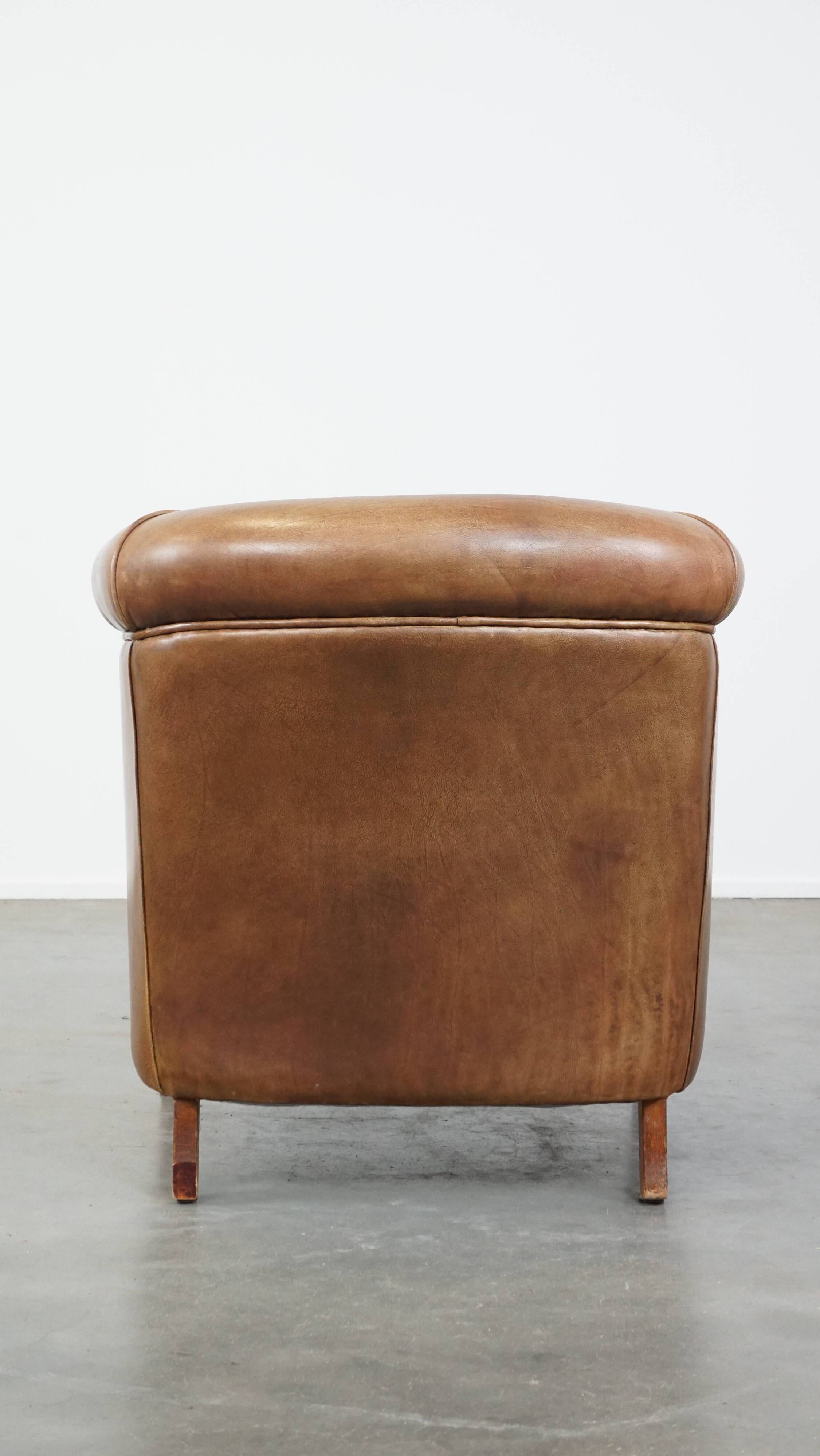 Fauteuil club en cuir de vachette couleur cognac clair