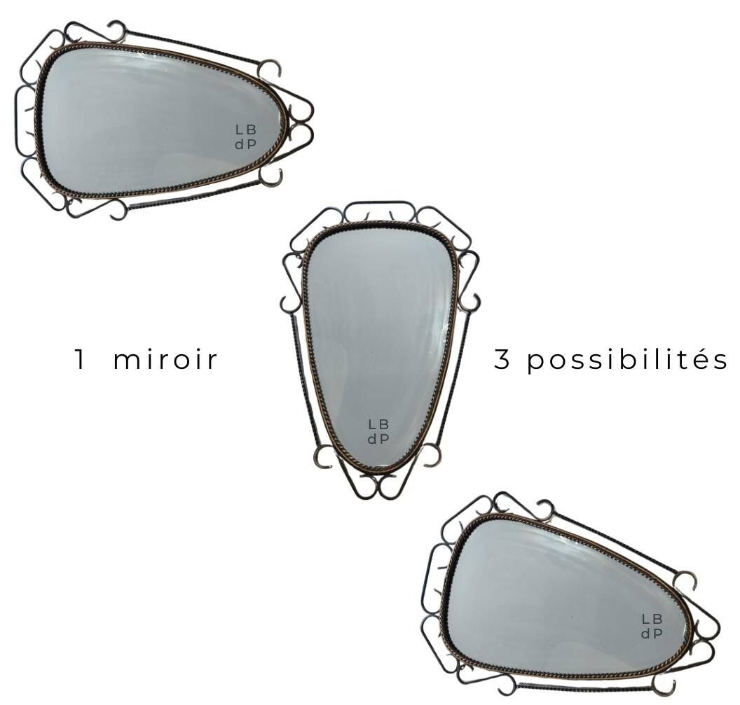 Mid-century modern iron mirror, brutalist, vintage organic, thick sixties.