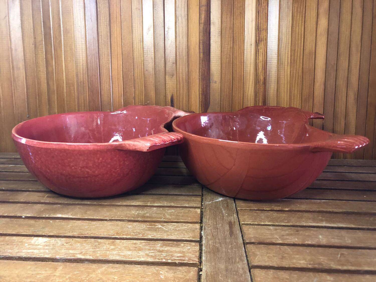 Pair of red ceramic hen dish