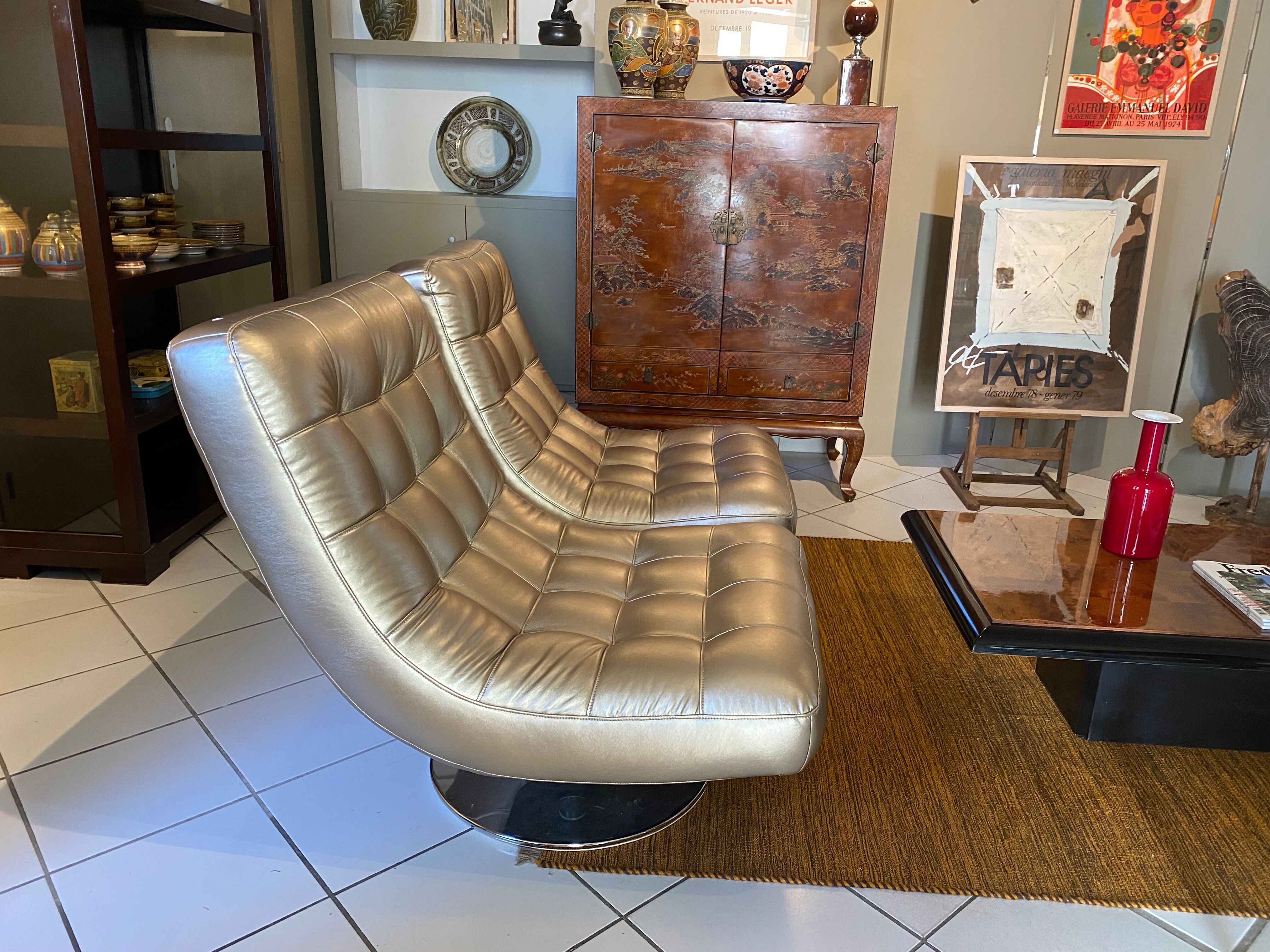 Pair of leather design armchairs