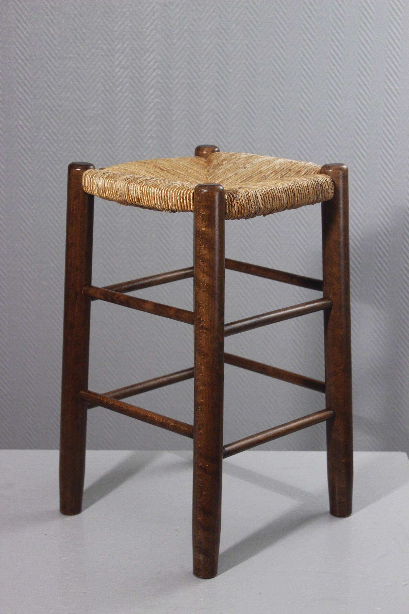 Vintage straw stool in the style of Charlotte Perriand, 1970s.