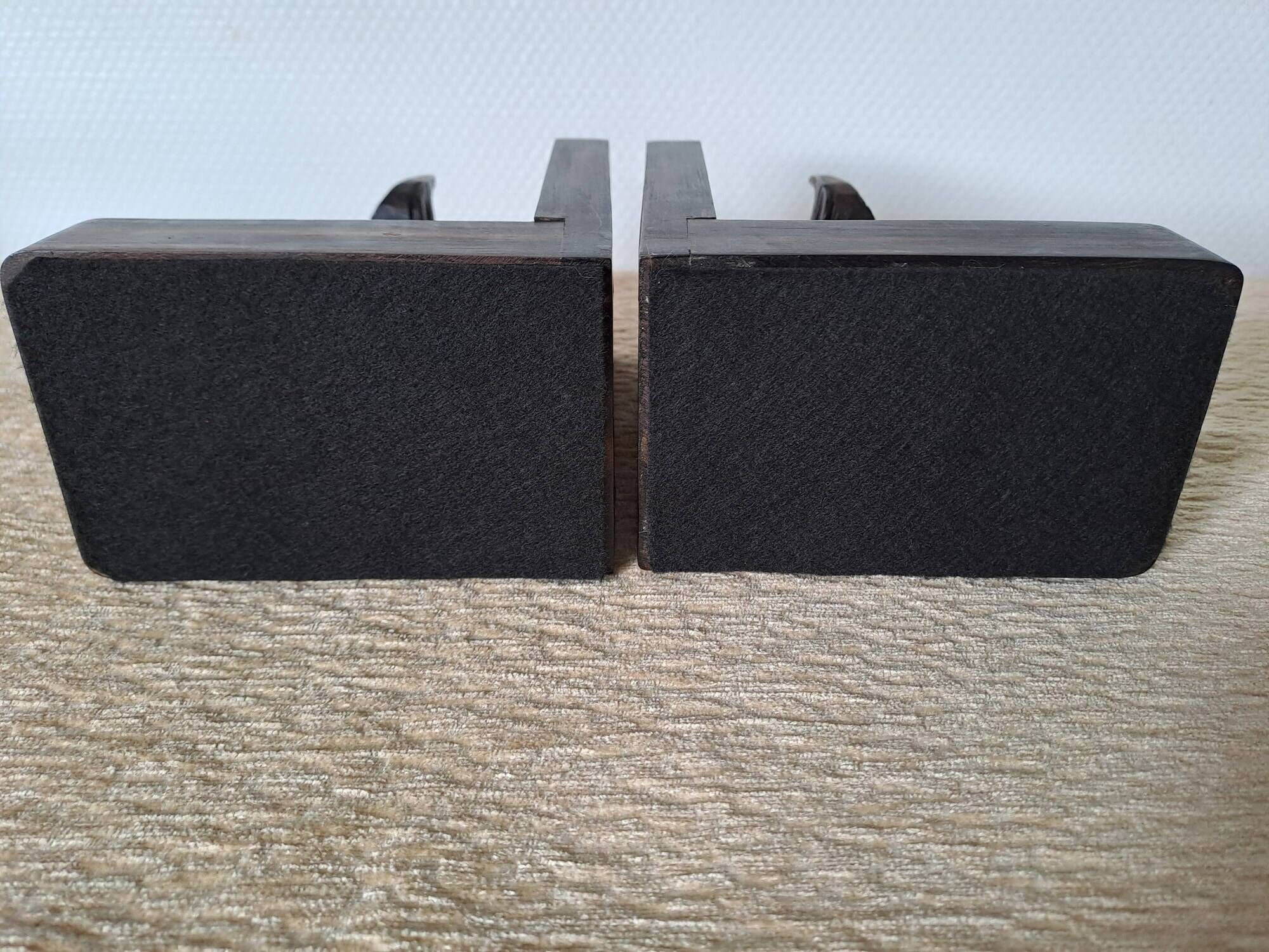 Pair of vintage wooden bookends with stylised horse heads.