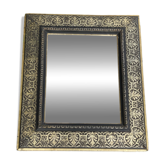 Bevelled mirror from the 19th century with gold and black palmettes.