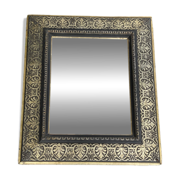 Bevelled mirror from the 19th century with gold and black palmettes.