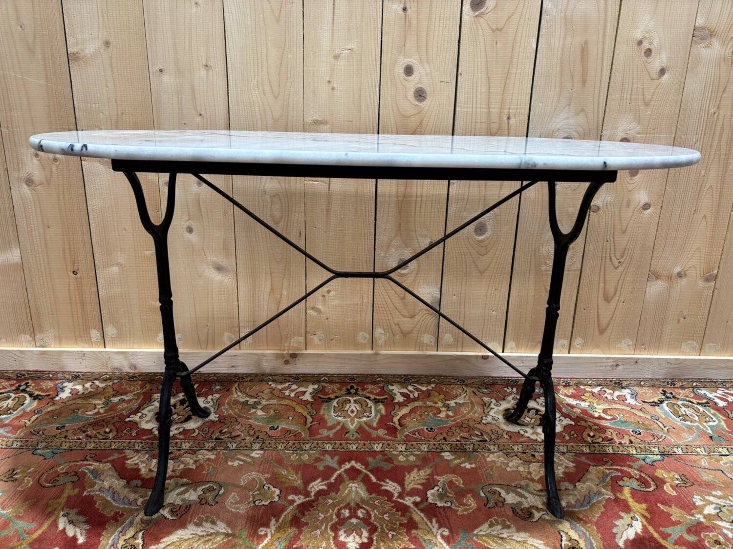 Authentic bistro table with white marble and cast iron from the early 20th century.