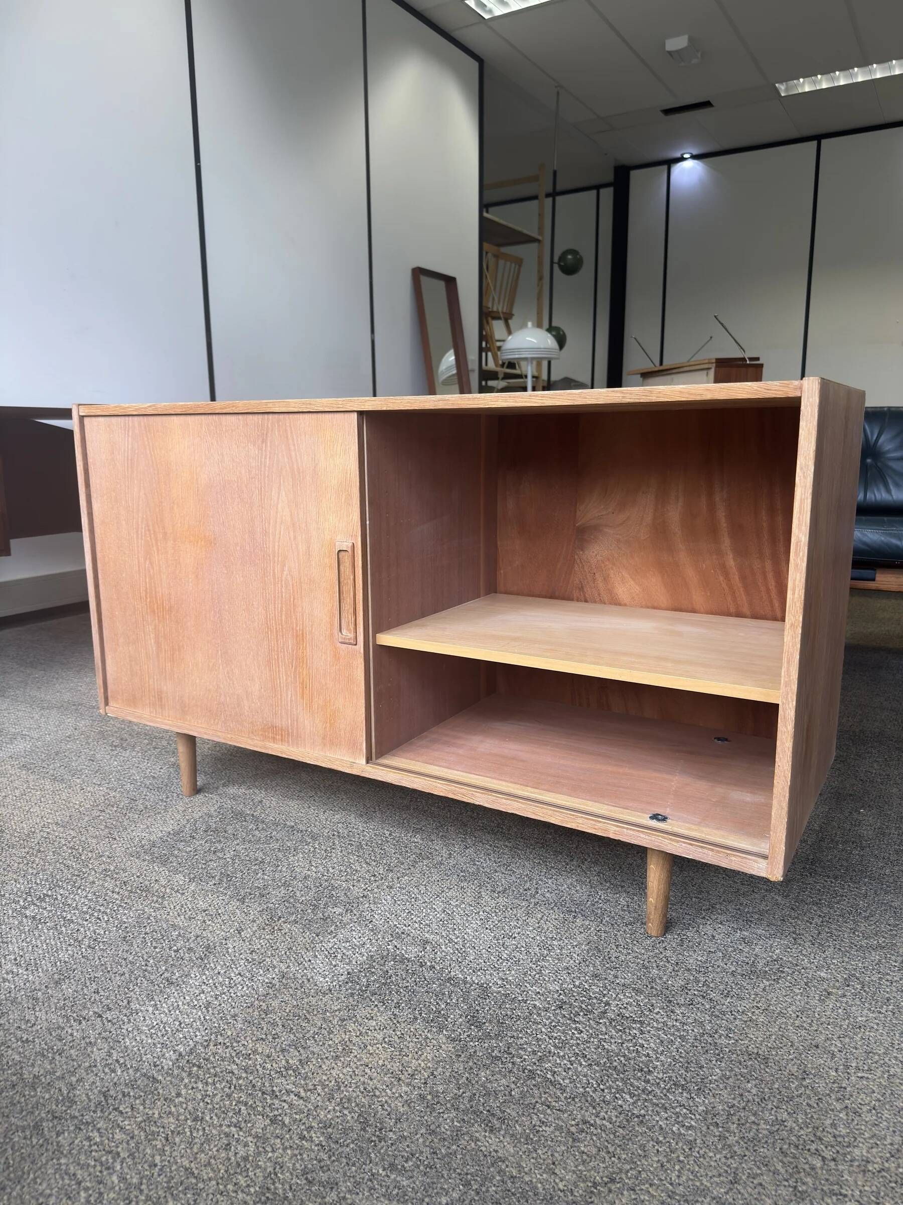 Danish buffet in light oak with sliding door and four drawers.
