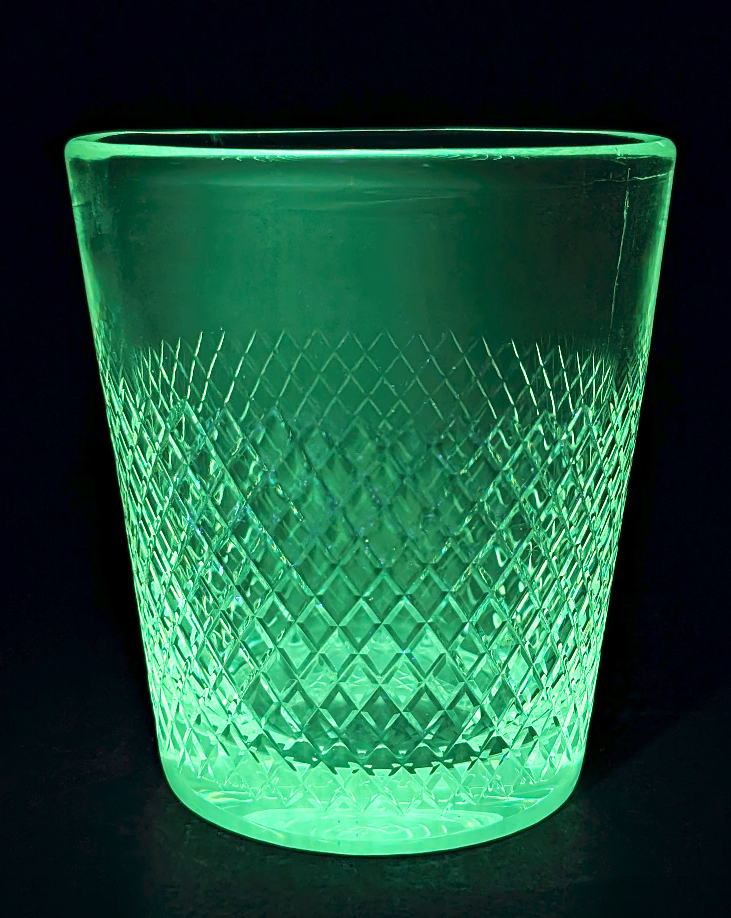 Vintage crystal ice bucket with gold tongs.