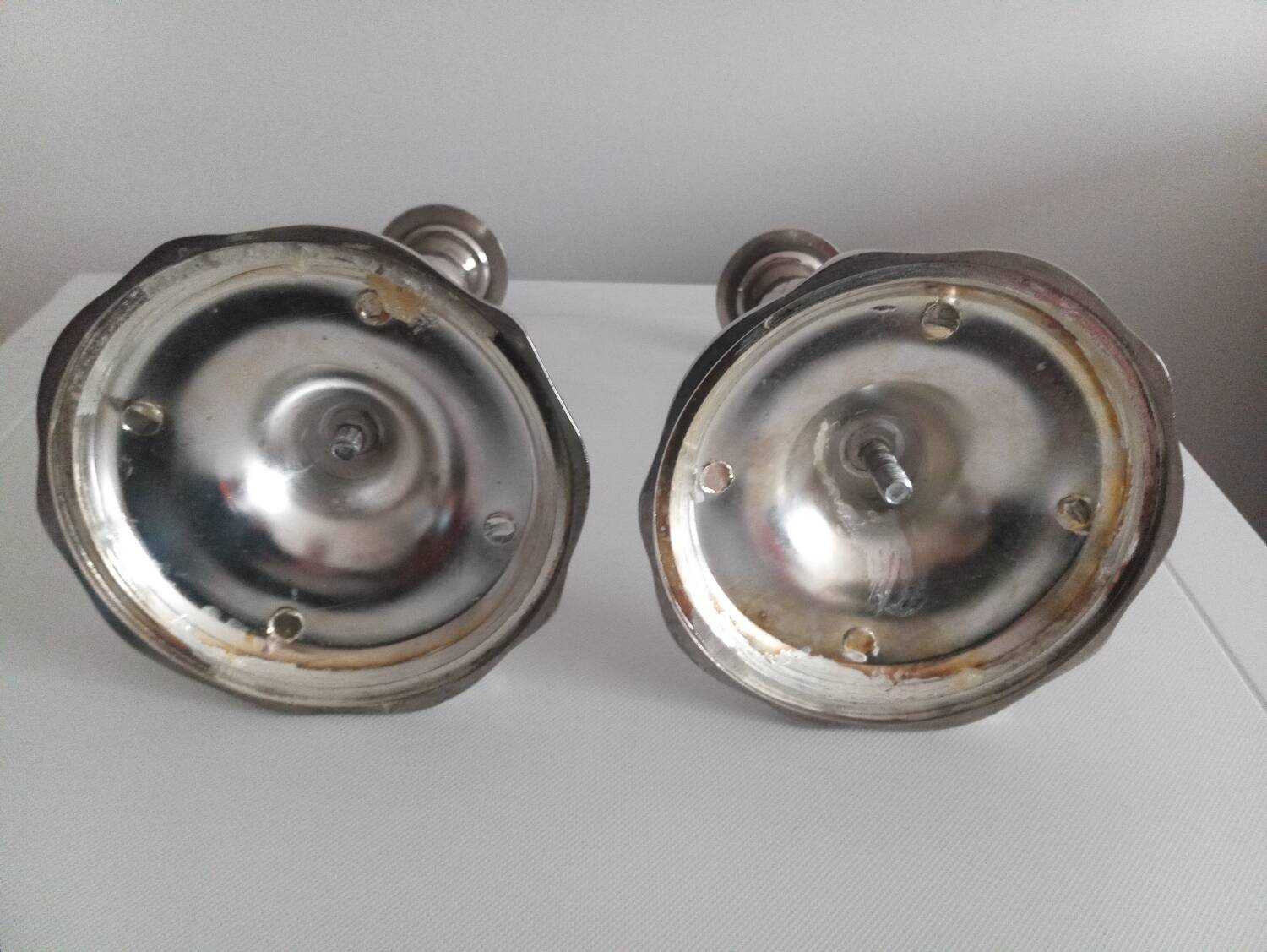 Pair of silver-plated metal candlesticks