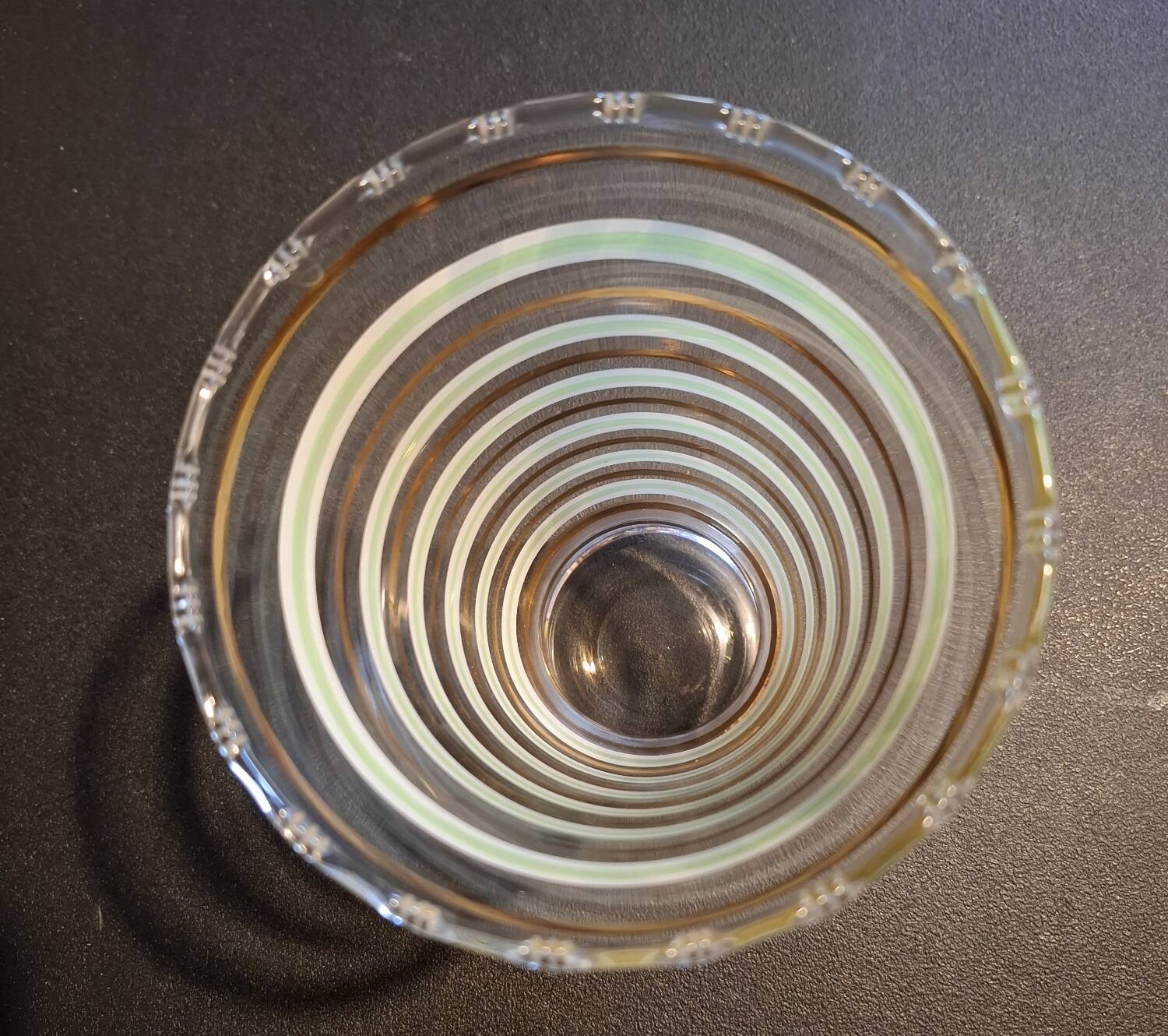 Vintage vase with green and gold trim.