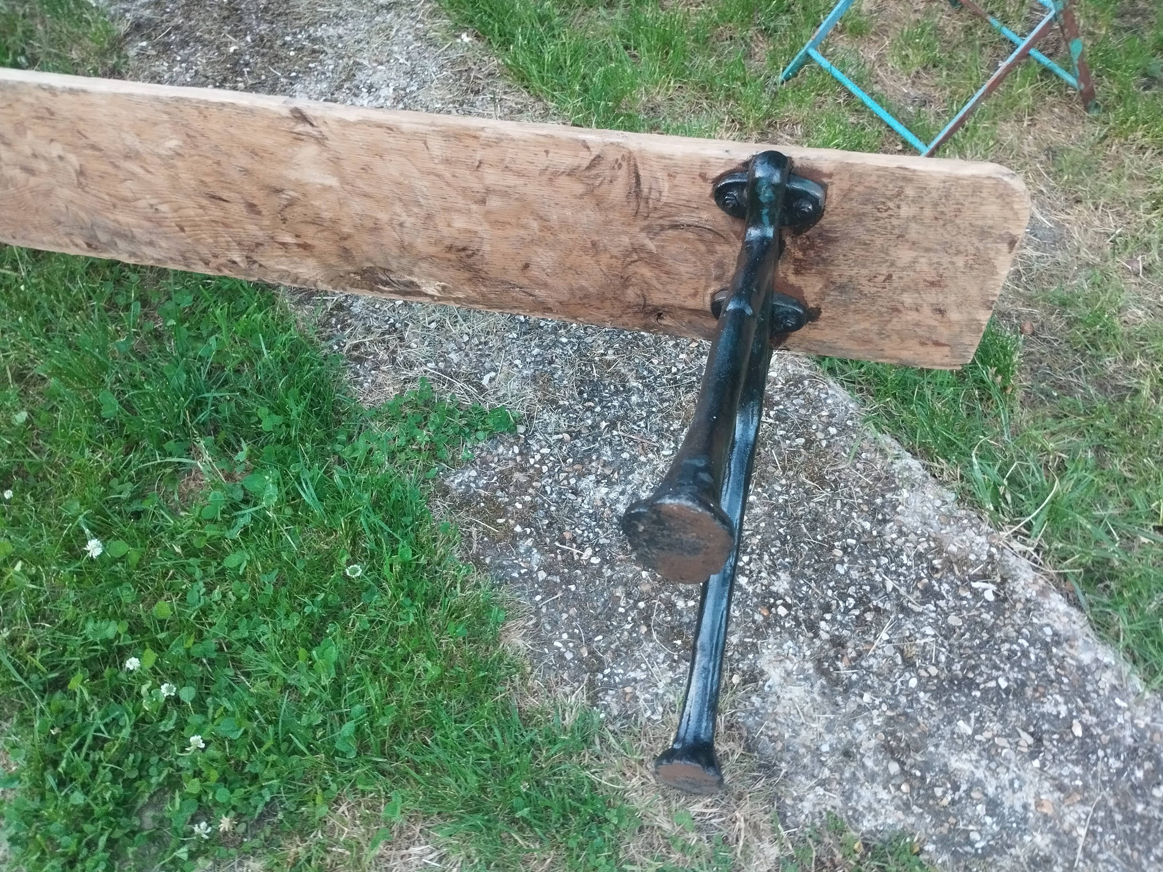 Antique garden bench with cast iron legs