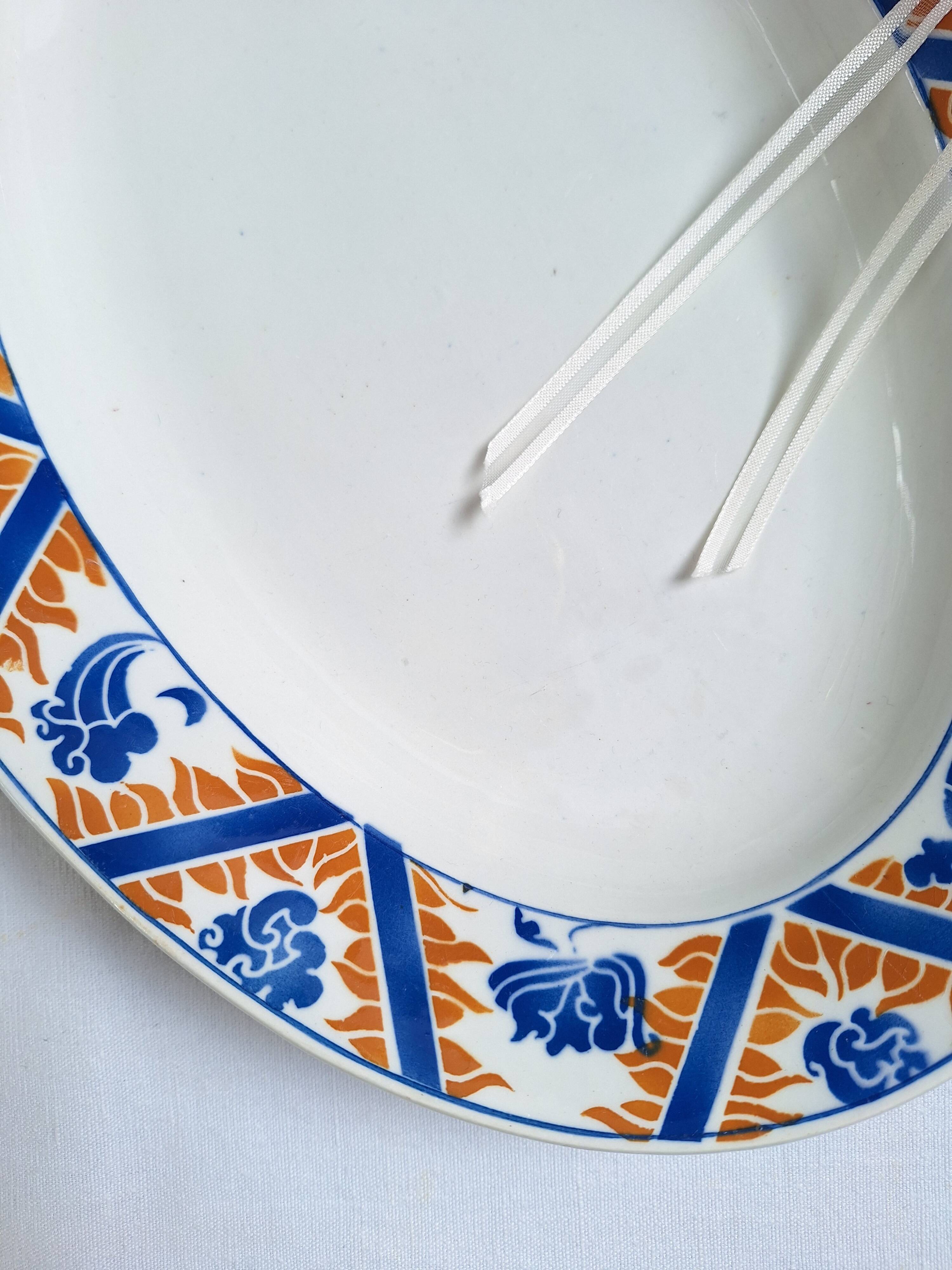 Oval plate Moulin des Loups Canada blue and orange, 1920-40