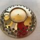Lattice brass catchall and candlestick.