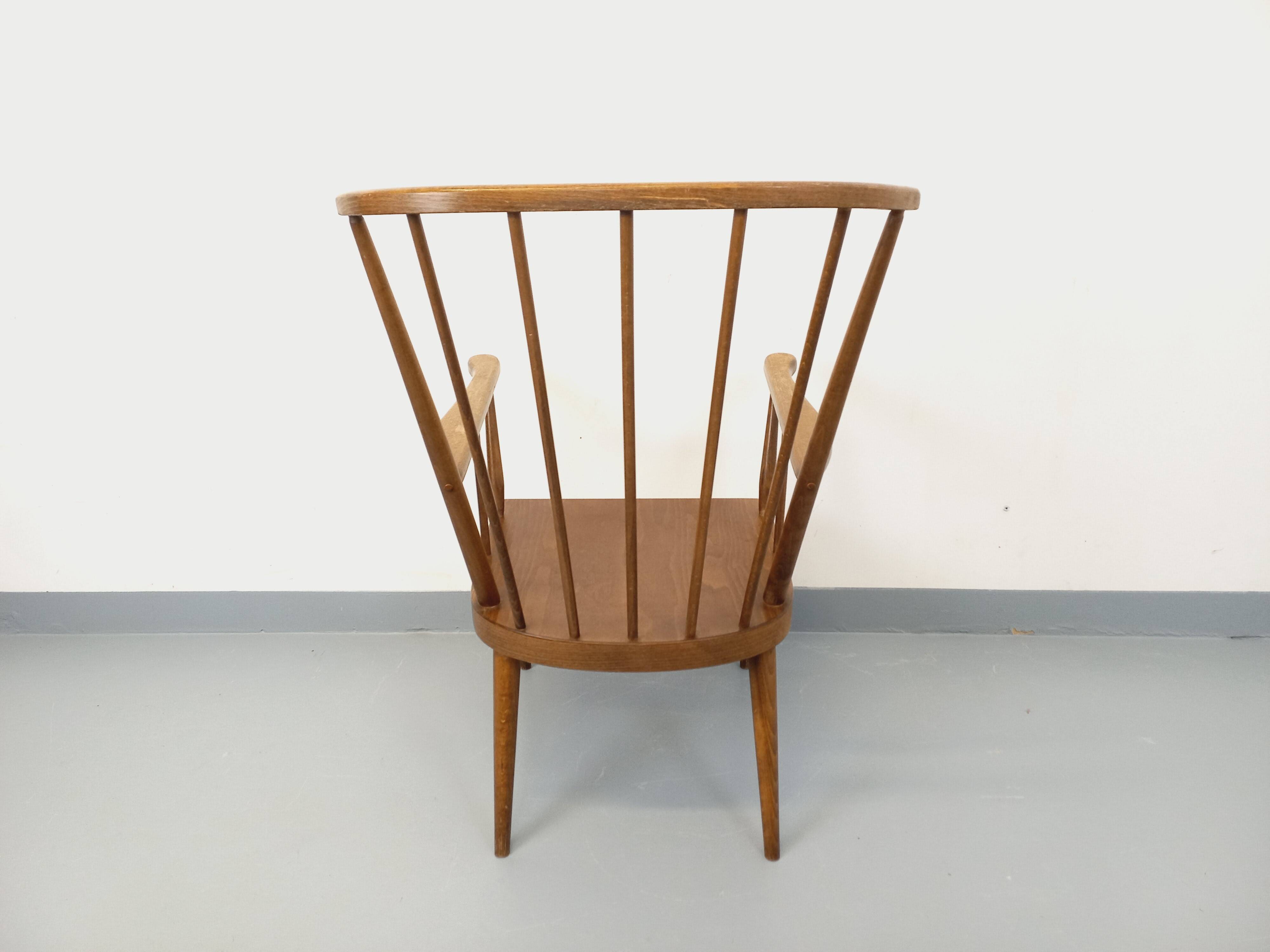 Vintage wooden armchair Baumann model Éventail from the 1960s.