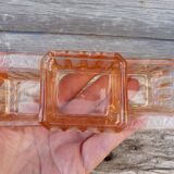 Glass condiment service in transparent pink moulded glass.