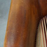 Set of 2 cognac-colored sheepskin club chairs with colorful fabric cushions