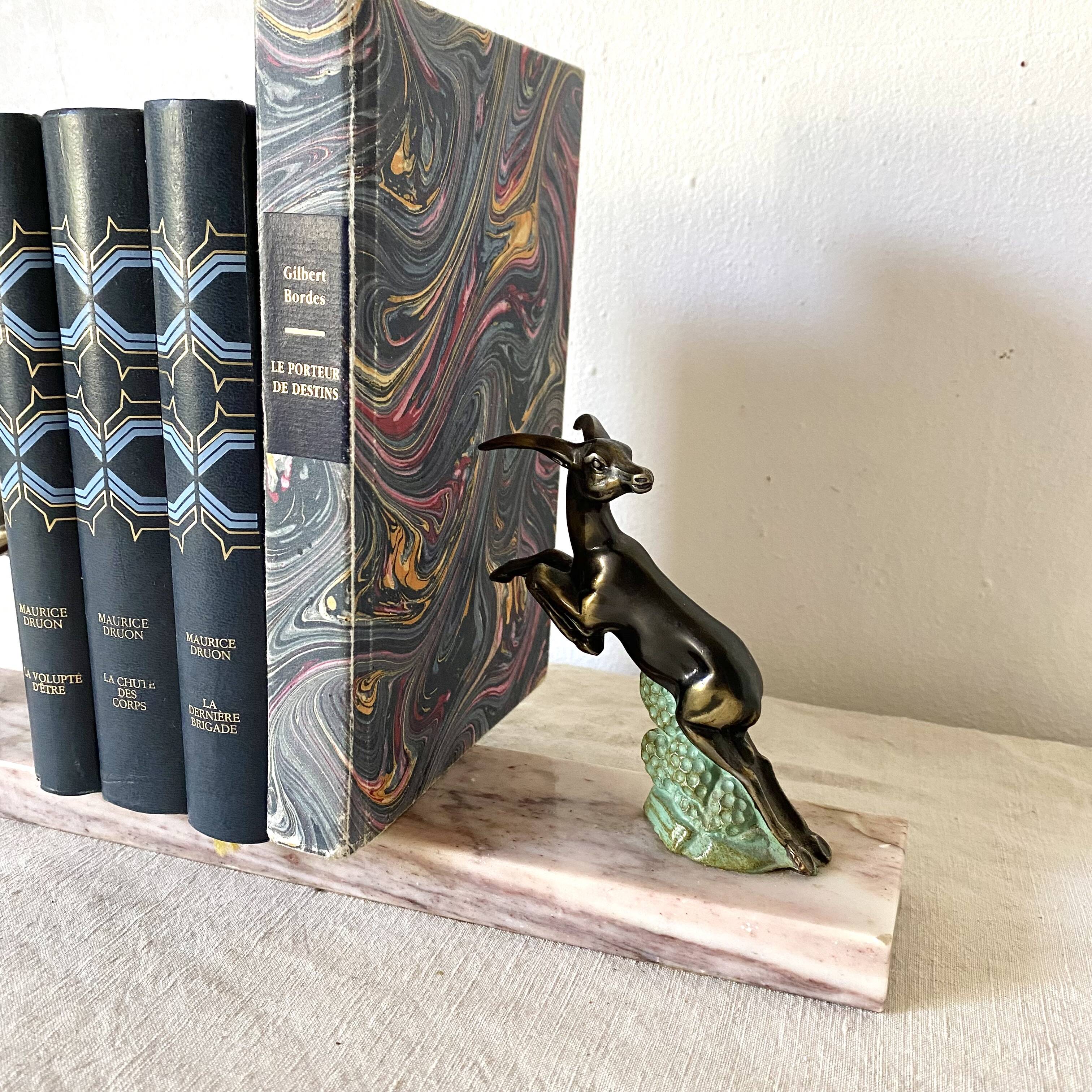 Art deco bookends in pink marble and spelters, antelopes