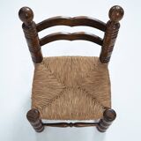 Low woven straw chair in the manner of Charles Dudouyt, 1940s