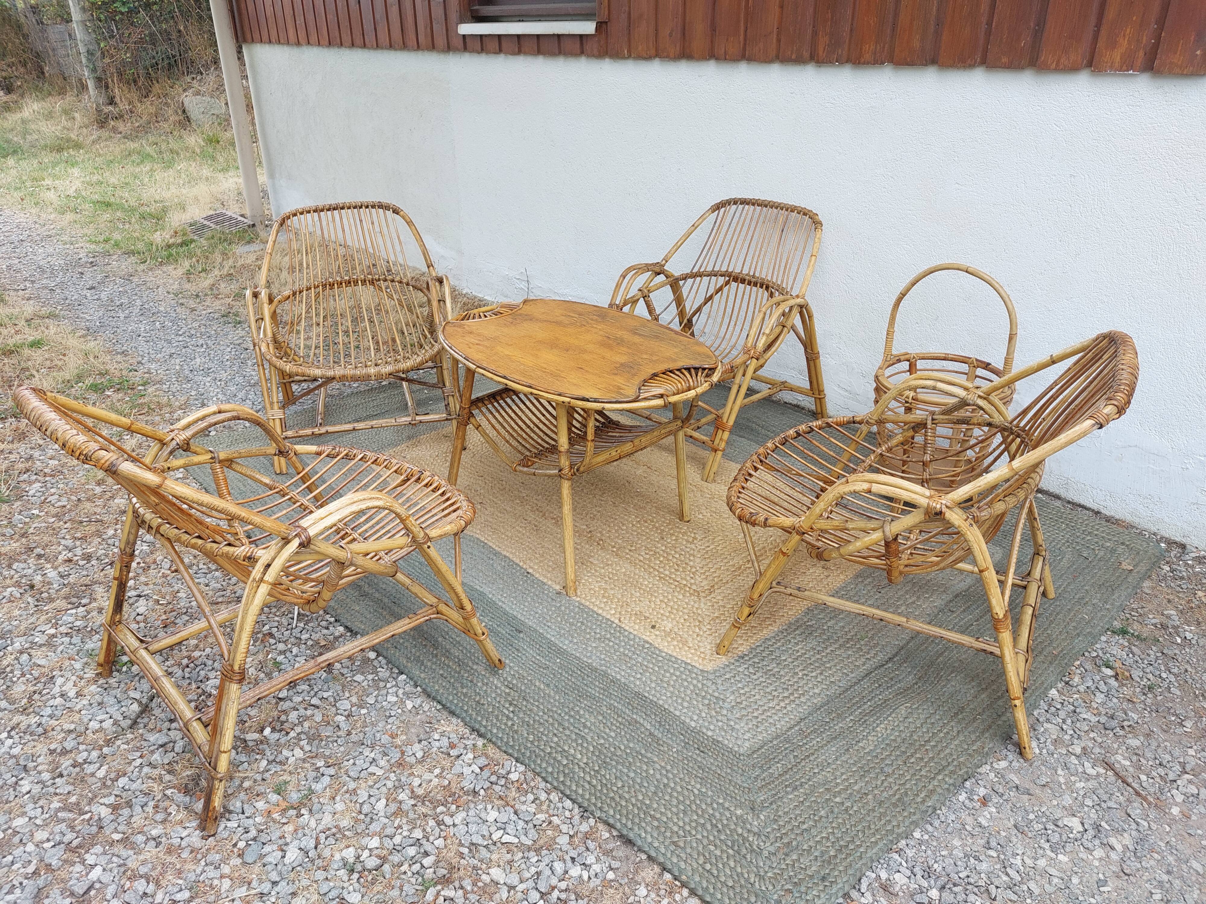 4 armchairs and a coffee table made of rattan and bamboo wood, vintage.