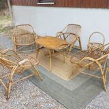 4 armchairs and a coffee table made of rattan and bamboo wood, vintage.