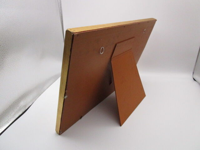 Old wooden and gilded stucco frame