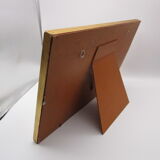 Old wooden and gilded stucco frame