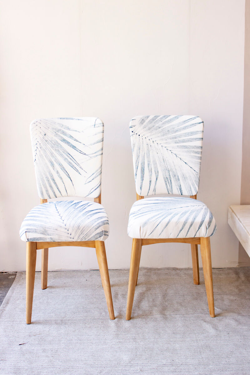 Pair of vintage chairs reupholstered with palm pattern fabric