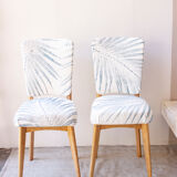 Pair of vintage chairs reupholstered with palm pattern fabric